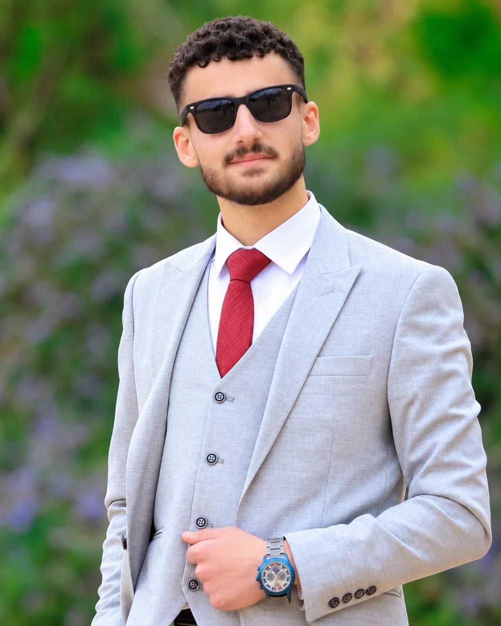Portrait of Adel Jarrar wearing a light gray suit